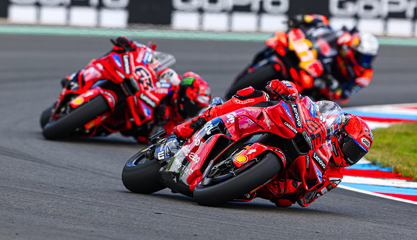 Marc Marquez, Francesco Bagnaia, and Pedro Acosta going around a corner around Bruno.