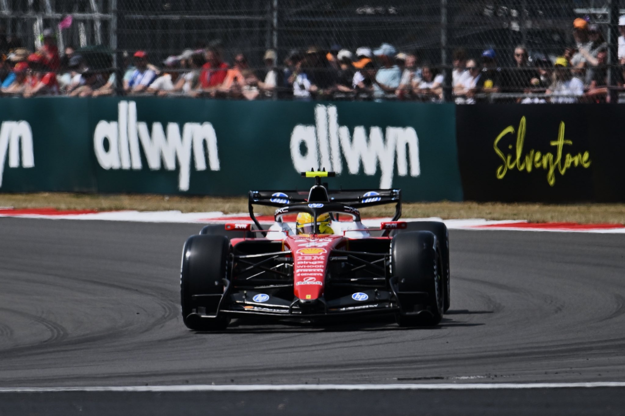 Lewis Hamilton is going around a corner at Silverstone